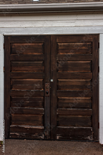 dark wooden double door © Taya