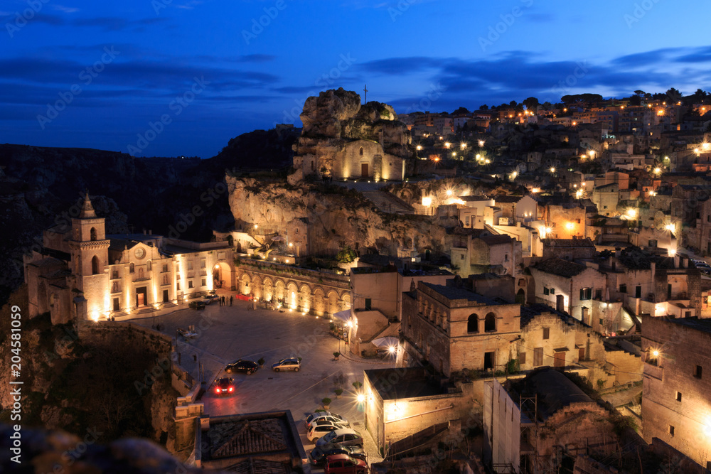 Italy, Southern Italy, Region of Basilicata, Province of Matera, Matera. The town lies in a small canyon carved out by the Gravina. Overview of town. The cave church Madonna de Idris.