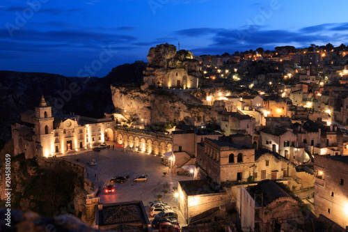 Italy, Southern Italy, Region of Basilicata, Province of Matera, Matera. The town lies in a small canyon carved out by the Gravina. Overview of town. The cave church Madonna de Idris. © Emily_M_Wilson