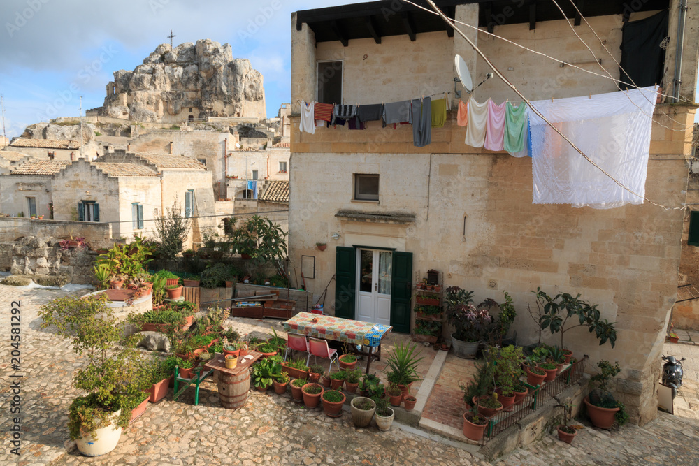 Italy, Southern Italy, Region of Basilicata, Province of Matera, Matera. The town lies in a small canyon carved out by the Gravina.Laundry drying on line.  November 28, 2016