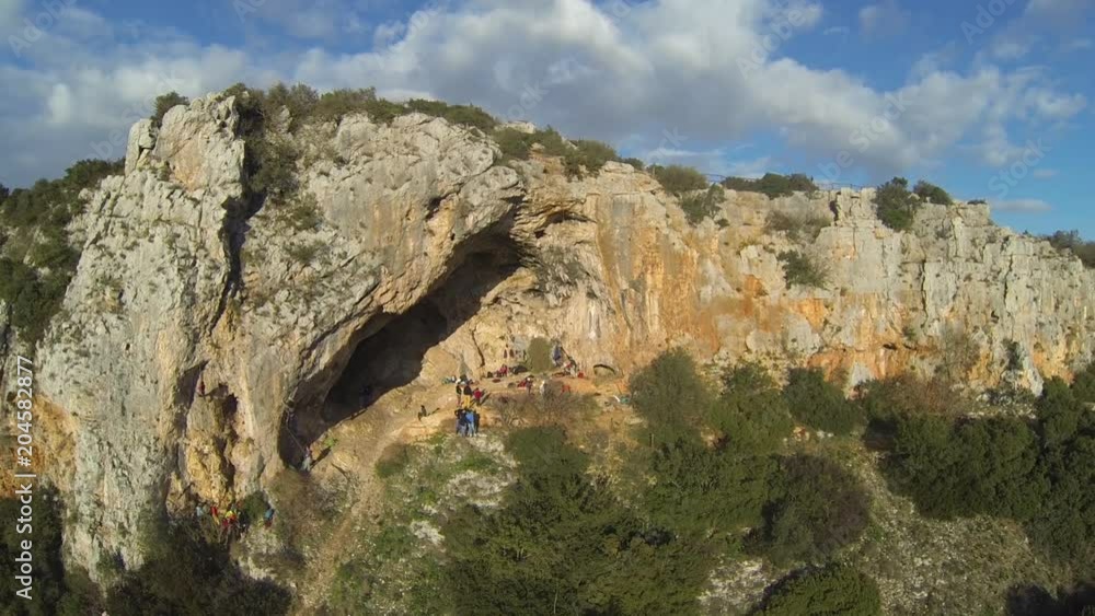 People visit cave near Gravina in Puglia, aerial People visit cave near Gravina in Puglia, aerial