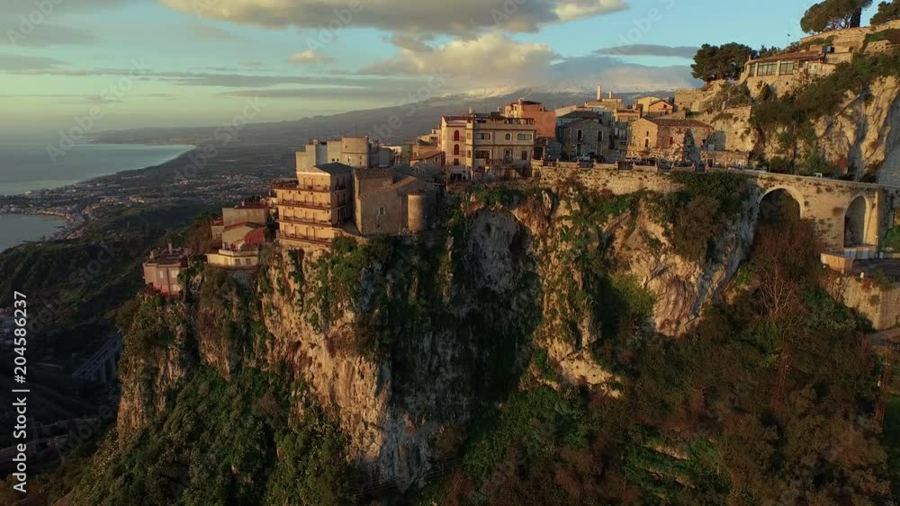 Sunset over Taormina skyline, aerial Sunset over Taormina skyline, aerial