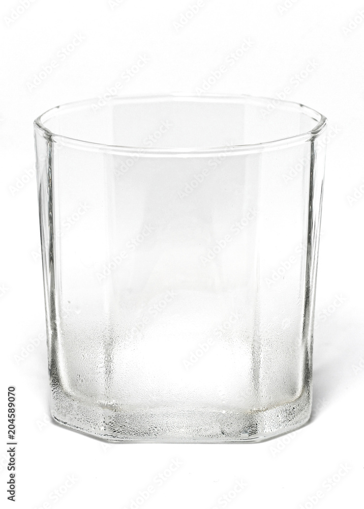 Shape design whisky water clear glass with cold wet steam and vapor close up isolated on white background Shape design whisky water clear glass with cold wet steam and vapor close up isolated on white background
