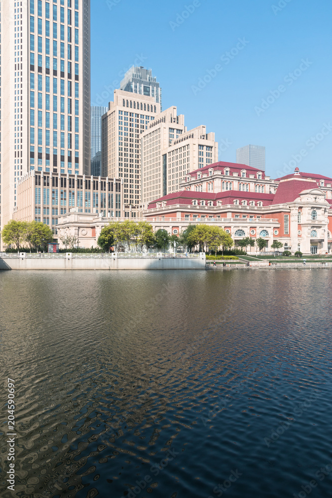 Obraz premium Cityscape of Tianjin, China. The word on the building is: Tianjin Station.