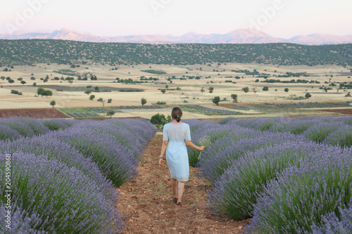 young woman walking in the lavender farm
