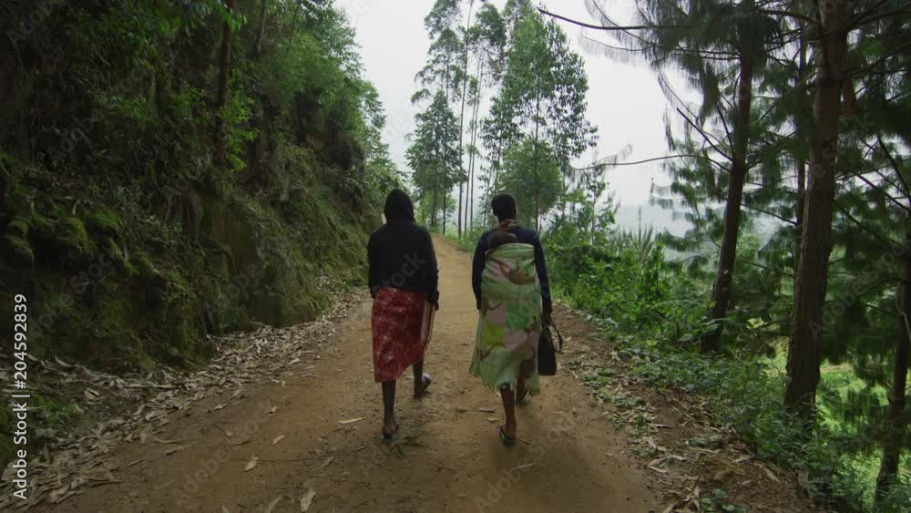 African women walking on a road African women walking on a road