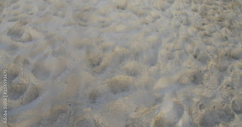 Seawater waves and sand beach Waves gently wash up onto the beach Seawater waves and sand beach Waves gently wash up onto the beach