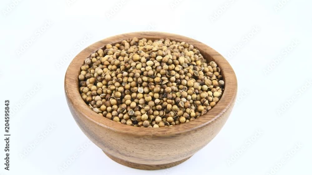 Coriander seeds in wood bowl on white rotation
Coriander seeds in wood bowl on white rotation