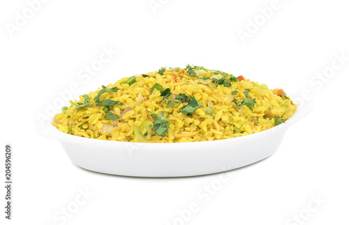 Indian Breakfast Dish Poha Also Know as Pohe or Aalu poha made up of Beaten Rice or Flattened Rice. The rice flakes are lightly fried in oil with mustard, chilly, onion, curry leaves and turmeric photo