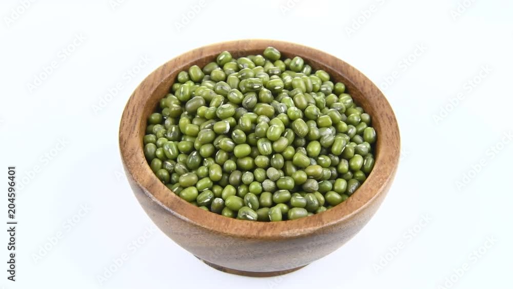 green beans in wood bowl on white. rotation green beans in wood bowl on white. rotation
