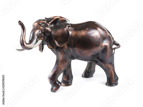 A realistic elephant figurine isolated over a white background