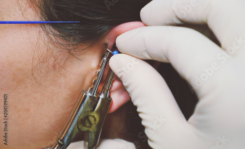 Fotografie Close up on equipment for ear piercing
