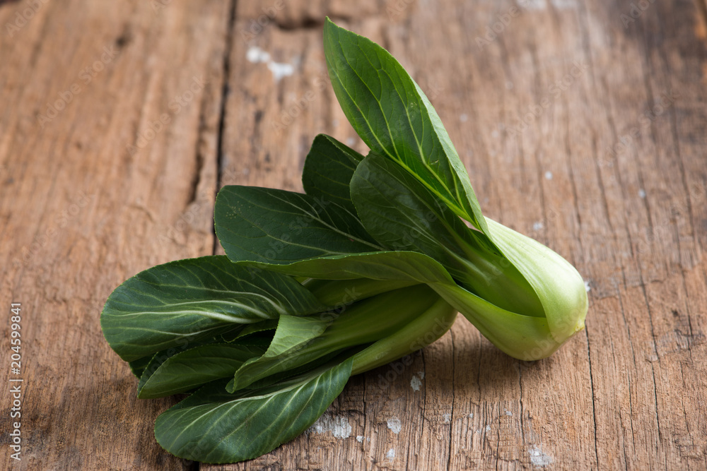 Pak Choy, fresh chinese cabbage on wood background Pak Choy, fresh chinese cabbage on wood background