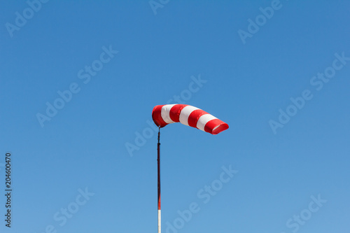 Windsock as a gauge for winds, wind vane on aerodrome airfield on an air show