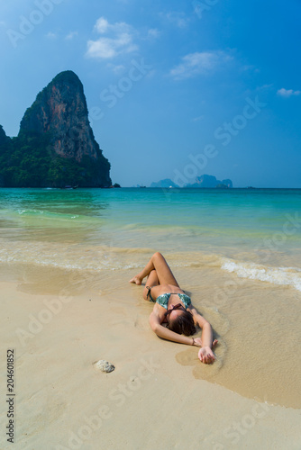Fototapeta Naklejka Na Ścianę i Meble -  woman resting at the  tropical Railay beach