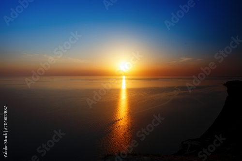 Sunset view from mountaintop. Tourism, travel, sea background.