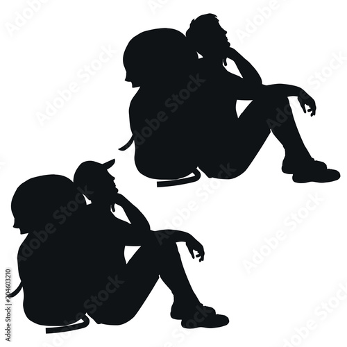 Isolated silhouette of a sitting hiker