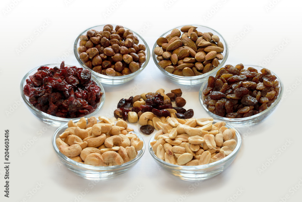 Healthy Snack - Nuts and Dried Fruit Mixed on a Small Pile Healthy Snack - Nuts and Dried Fruit Mixed on a Small Pile