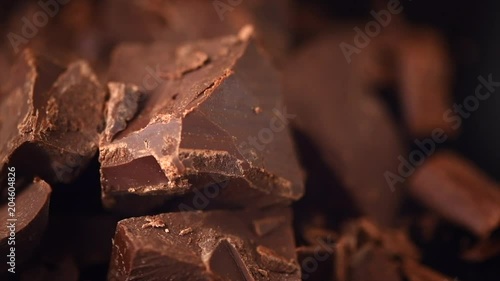 Wallpaper Mural Chocolate. Chunks of sweet dark chocolate rotated closeup. Dessert ingredient. Confectionery. Slow motion 4K UHD video 3840X2160 Torontodigital.ca