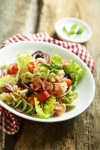 Homemade pasta salad with cherry tomatoes and olives