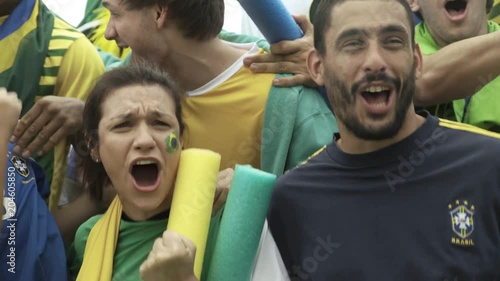 Brazilian soccer fans watching match at stadium