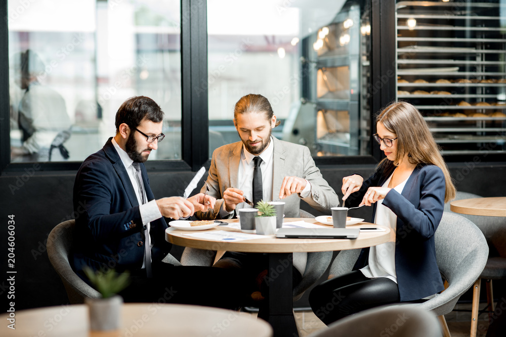 Business people eating in the cafe