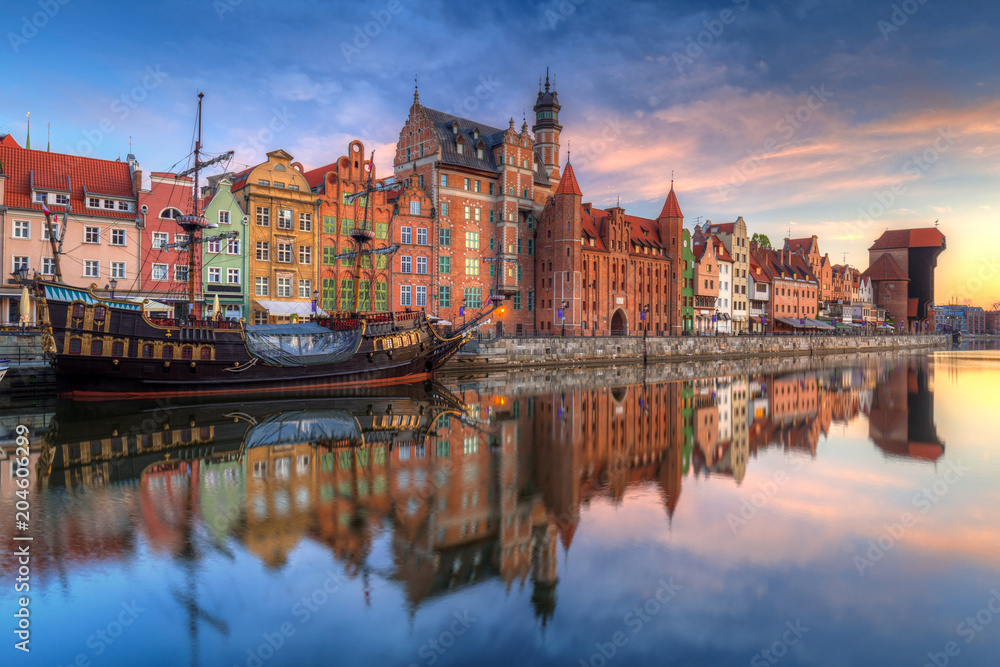Fototapeta premium Beautiful old town of Gdansk reflected in Motlawa river at sunrise, Poland.