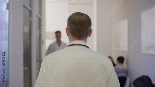 Wallpaper Mural Rear view of a doctor walking in a hospital  Torontodigital.ca