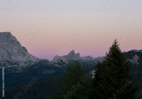 Dolomites sunset during summer time. Landscape to Conturines and Lagazuoi peaks and Falzarego mountain pass
