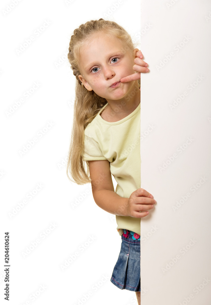 Little girl with long blond hair Peeps out from behind poster isolated on white Little girl with long blond hair Peeps out from behind poster isolated on white