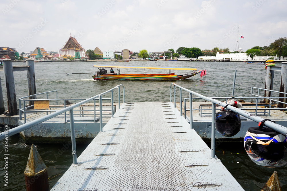 Fototapeta premium Bangkok, Thailand - Feb 05,2018. The view from Thai temple with local boat on the river.