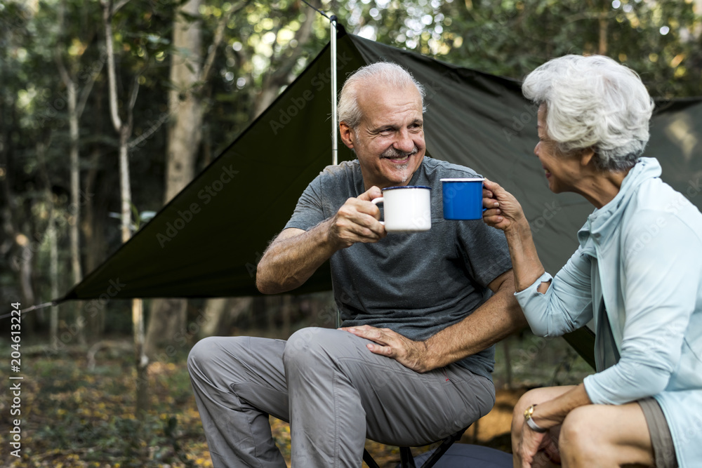 Friends having coffee at a campsite Friends having coffee at a campsite