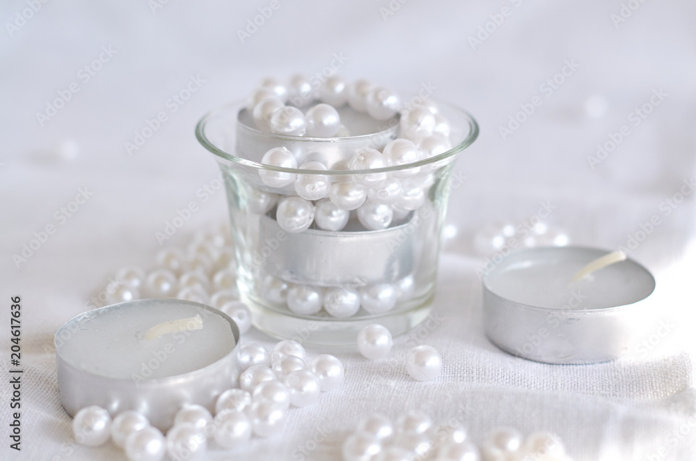 candle, white beads and glass bowl candle, white beads and glass bowl