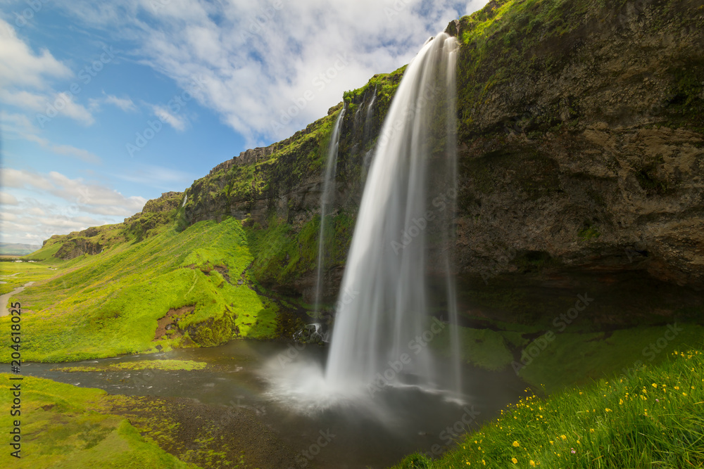 Icelandic waterfall Seljalandsfoss Icelandic waterfall Seljalandsfoss