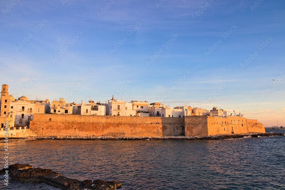 Monopoli old town view from the sea at sunrise, Puglia, Italy