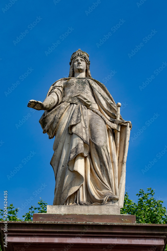 Old Sculpture in front of a blue sky