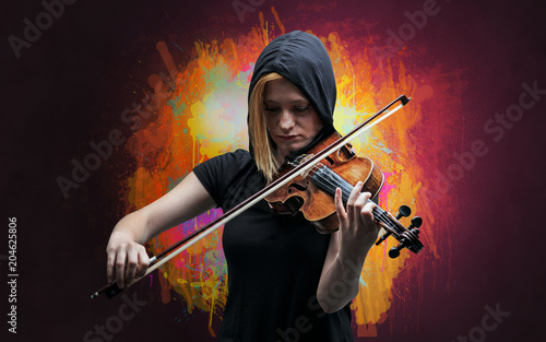 Young classical violinist musician with colorful splotch wallpaper 