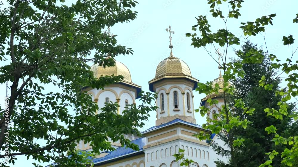 Orthodox church, Catholic church, dome of a church against a blue sky, Against the skyGolden domes Orthodox church, Catholic church, dome of a church against a blue sky, Against the skyGolden domes