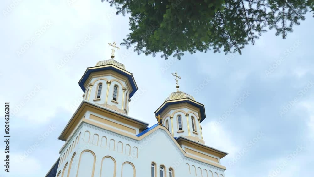 Orthodox church, Catholic church, dome of a church against a blue sky, Against the skyGolden domes Orthodox church, Catholic church, dome of a church against a blue sky, Against the skyGolden domes
