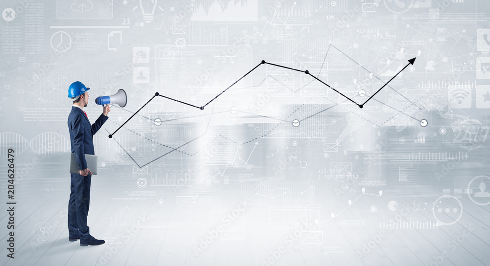 Engineer with construction helmet holding a plan and standing with graphs, charts and reports on the background Engineer with construction helmet holding a plan and standing with graphs, charts and reports on the background