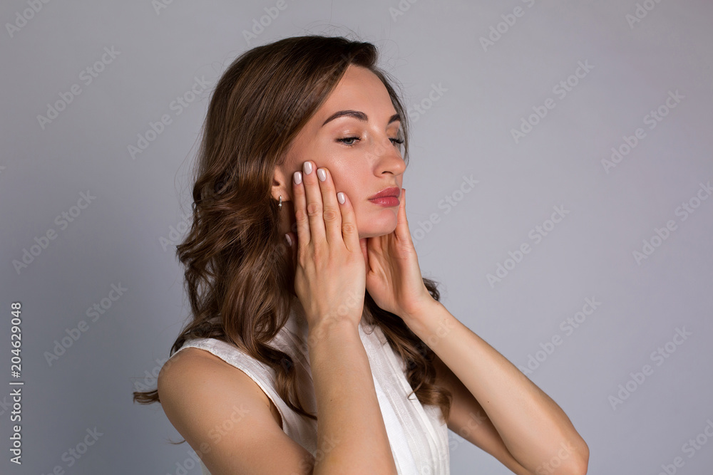 young woman makes herself a massage complex of exercises young woman makes herself a massage complex of exercises