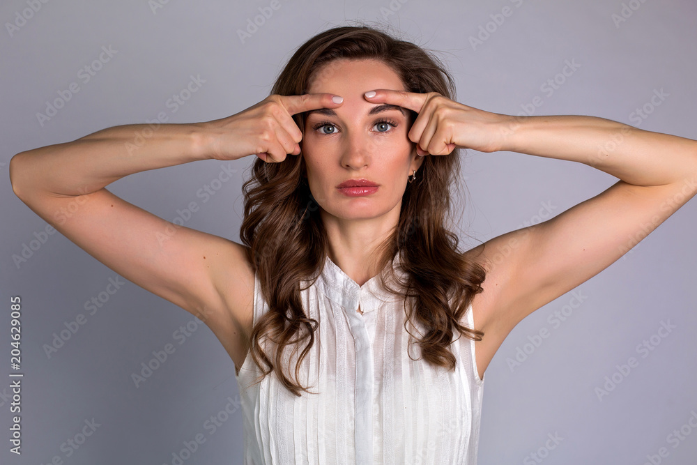 young woman makes herself a massage complex of exercises young woman makes herself a massage complex of exercises