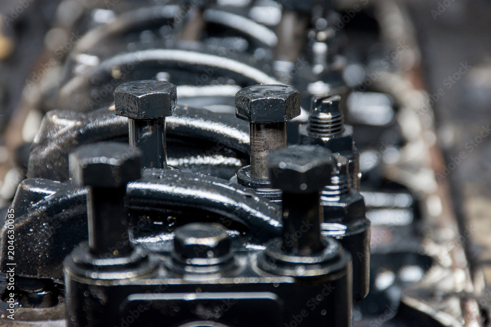 Details of a dirty diesel engine under the hood of a car Details of a dirty diesel engine under the hood of a car