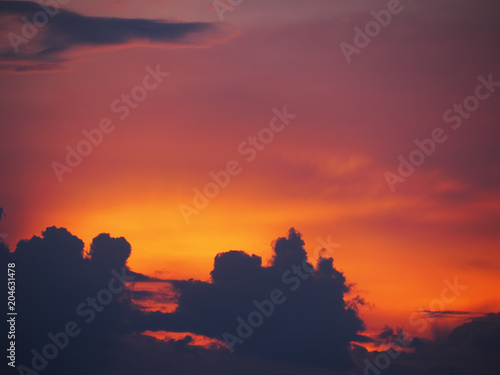 Blue and red sky with soft pink colorful clouds at the sunset background