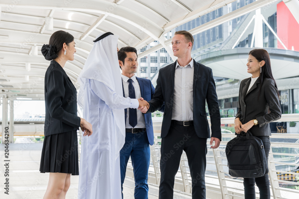 Group of business people standing in the city and discussing ideas for business future. multi culture of business people, African, Caucasian and Asian.