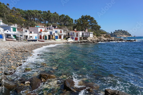 Spain old fishermen houses on the waterfront, Cala S'Alguer cove in Palamos, Mediterranean sea, Costa Brava, Catalonia, Baix Emporda