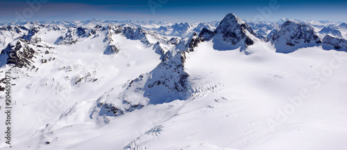 gorgeous winter mountain landscape with the famous Piz Buin and a glacier in the Swiss Alps