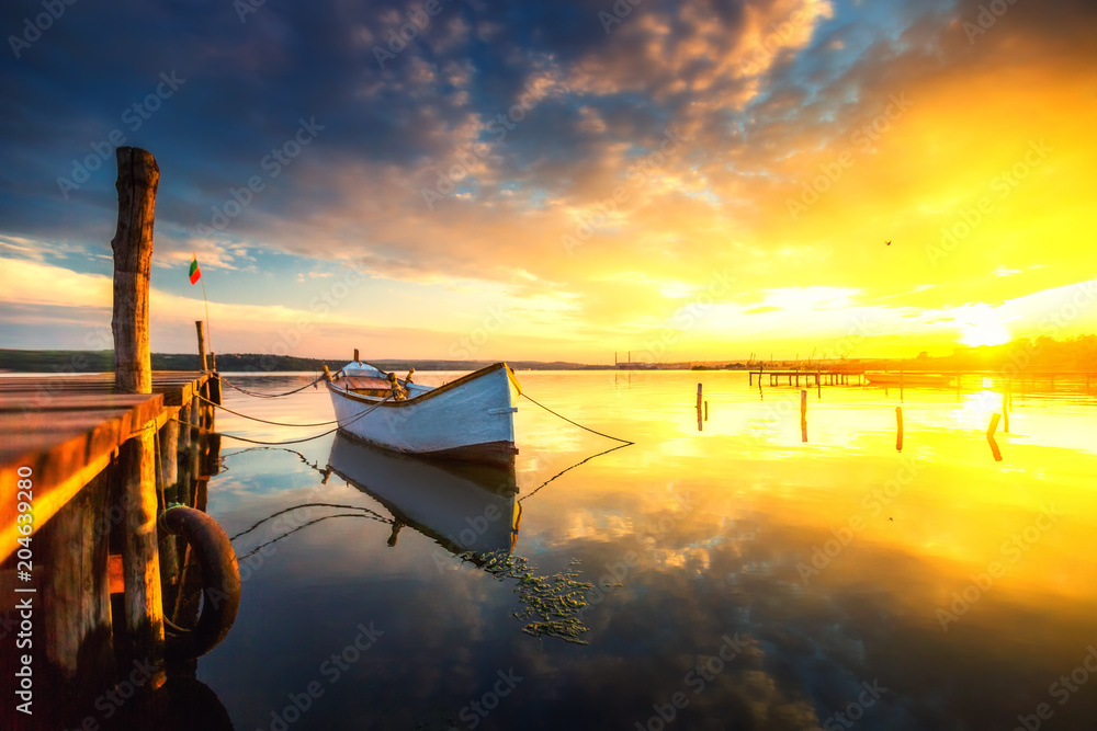 Fototapeta premium Small Dock and Boat at the lake, sunset shot