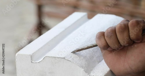 Man carving stone. Handmade crafts .