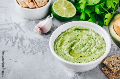 Avocado dip with cilantro and lime photo
